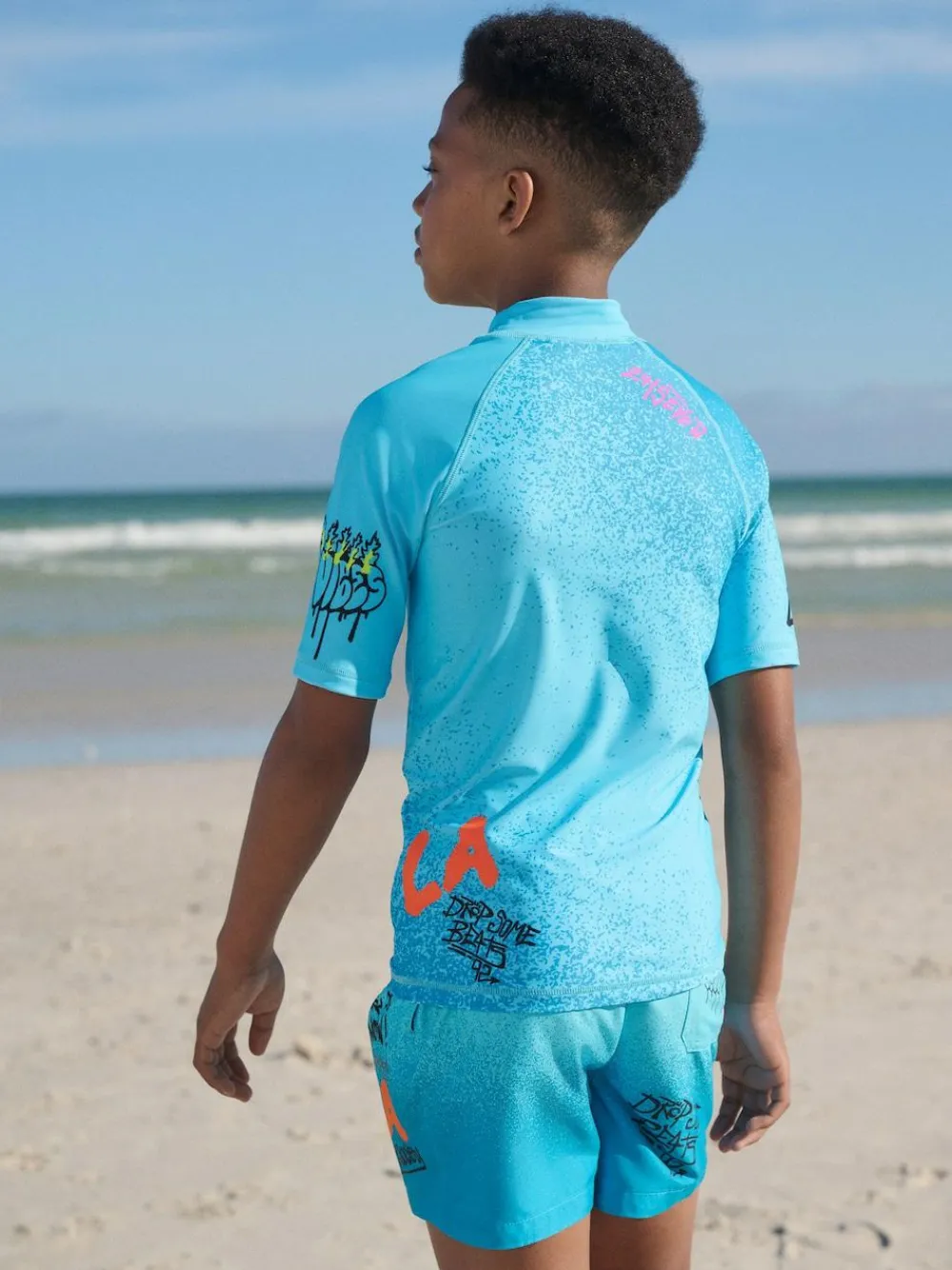 Next Blue Graffiti Short Sleeve Rash Vest (1.5-16yrs)^BOY Swimwear