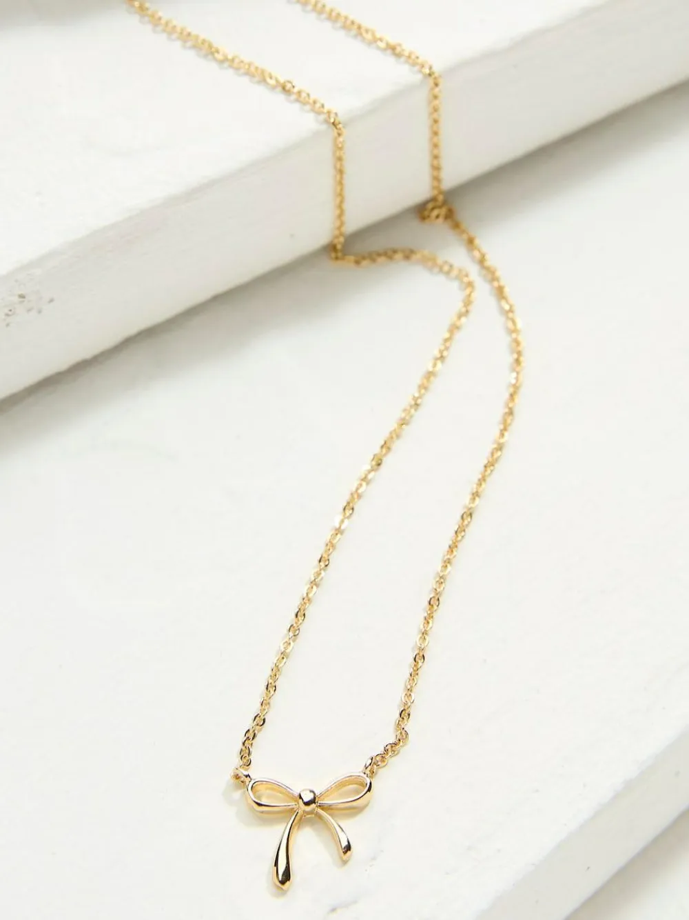 Online Fat Face FatFace Gold Tone Bow Pendant Necklace