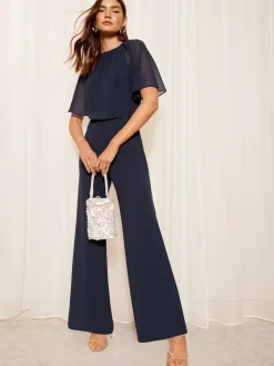 Friends Like These Petite Chiffon Flutter Sleeve Scuba Jumpsuit^Women Jumpsuits & Playsuits