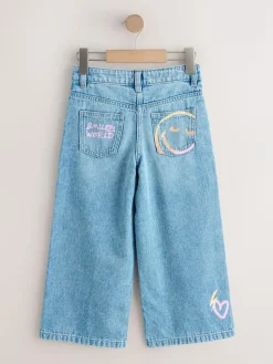 Next Mid Blue SmileyWorld® Print Wide Leg Jeans (3-16yrs)^ Jeans