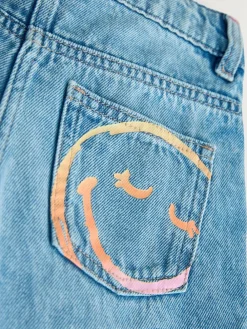 Next Mid Blue SmileyWorld® Print Wide Leg Jeans (3-16yrs)^ Jeans