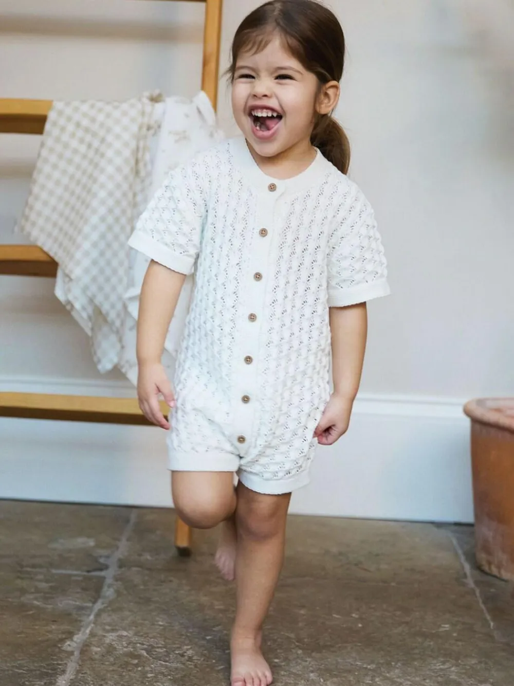 Discount The Little Tailor Baby Scallop Design Pointelle Button Through 100% Cotton Romper White