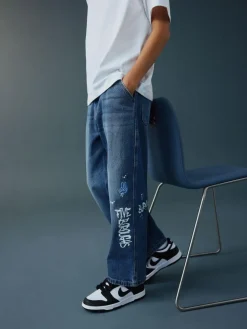 Next Varsity All-Over Print Mid Blue Denim Wide Fit Authentic Jeans (3-16yrs)^BOY Jeans|Jeans