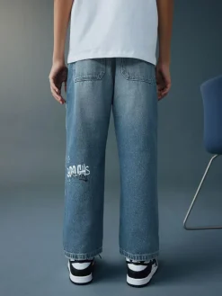 Next Varsity All-Over Print Mid Blue Denim Wide Fit Authentic Jeans (3-16yrs)^BOY Jeans|Jeans