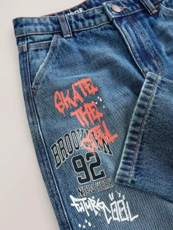 Next Varsity All-Over Print Mid Blue Denim Wide Fit Authentic Jeans (3-16yrs)^BOY Jeans|Jeans